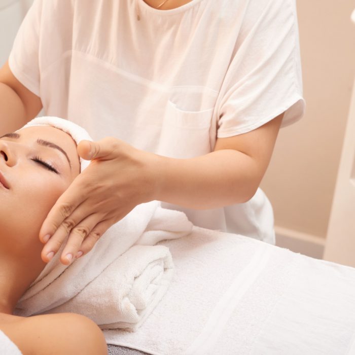 young-caucasian-woman-getting-anti-age-massage